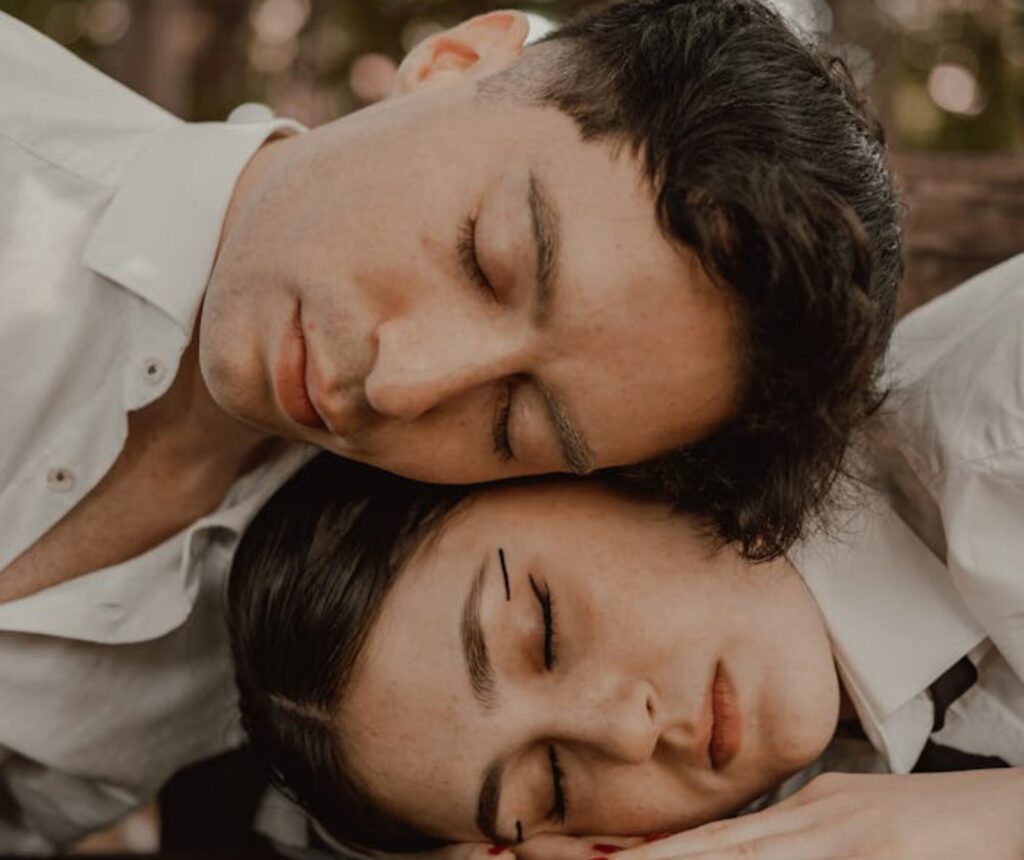 cropped-pexels-photo-28208826.jpeg A couple sleeping on a bench in the woods